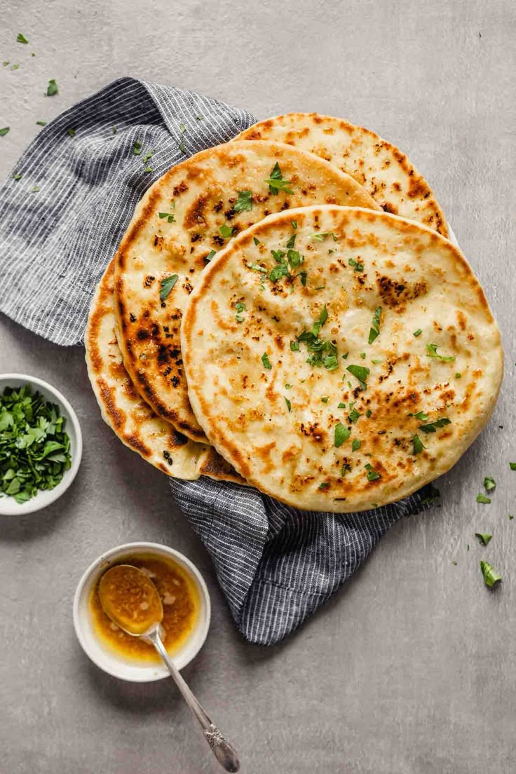 Stack of garlic naan with browned garlic butter